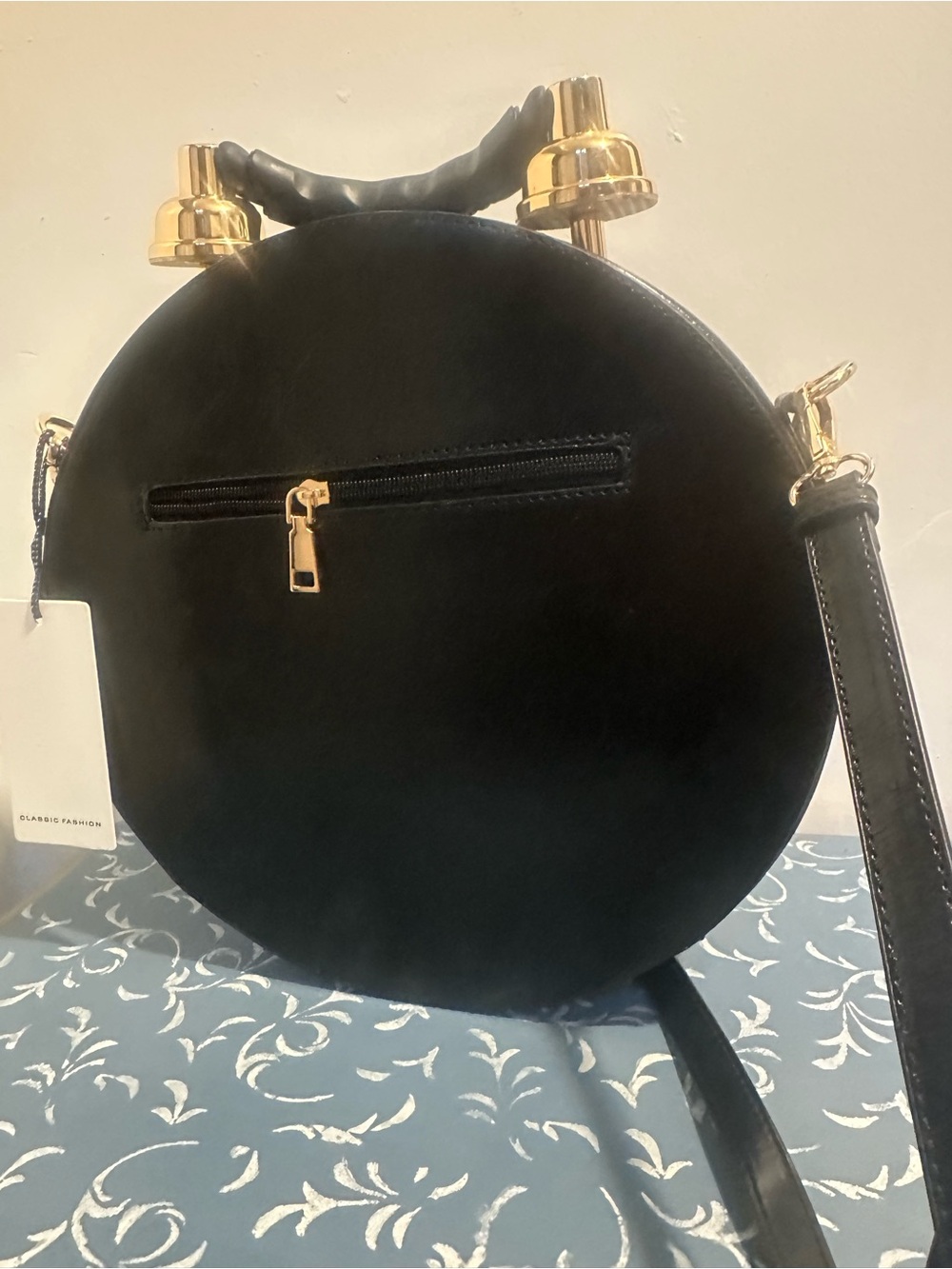 Round Clock-Face Crossbody Bag in Black with Gold Accents - Picture 2 of 3